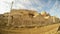 A ruined medieval castle Harran Kalesi fenced off, close to the border between Turkey and Syria