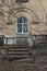 Ruined old decorative balustrade on the balcony columns postmodernism in the architecture of a historic residential building