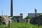 Ruined, old factory workshop for production of cellulose and paper, plant with chimney, facility, industry