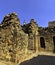 Ruined Quwwat ul-Islam Mosque with Qutb Minar tower in background at Qutub Minar complex