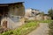 Ruined rammed earth farmhouse in vegetable field