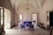 Ruined room of antique country house, with abandoned pieces of furniture