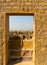 Ruined stone gateway leading to the haunted ruins of Kumbalgarh jaisalmer india