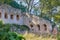 Ruined walls of an ancient castle with a window on a rock