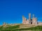 The ruins of the 14th-century fortification of Dunstanburgh Castle on the Northumberland coast in the north east UK.