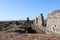 Ruins of the ancient agora at archaeological site Aspendos in Turkey under clear blue spring sky