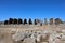 Ruins of the ancient agora at archaeological site Aspendos in Turkey under clear blue spring sky