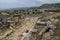 The ruins of the ancient ancient city of Hierapolis with columns, gates and graves in Pamukalle