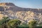 Ruins of an ancient city at the foot of the mountains