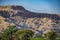 Ruins of an ancient city at the foot of the mountains