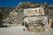 Ruins of ancient city of Myra in Demre, Turkey. Theatrical masks relief and ancient rock tombs