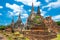 Ruins of ancient city and temples Ayutthaya, Thailand. Old kingdom of Siam. Summer day with blue sky. Famous tourist destination,