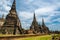 Ruins of ancient city and temples Ayutthaya, Thailand. Old kingdom of Siam. Summer day with blue sky. Famous tourist destination,