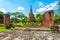 Ruins of ancient city and temples Ayutthaya, Thailand. Old kingdom of Siam. Summer day with blue sky. Famous tourist destination,