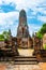 Ruins of ancient city and temples Ayutthaya, Thailand. Old kingdom of Siam. Summer day with blue sky. Famous tourist destination,