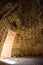 Ruins of ancient Greek tomb in Mycenae on Peloponnese, Greece