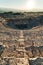 Ruins of ancient Hierapolis Amphi theatre with tourist Pamukkale, Denizili, Turkey. Evening sun