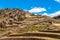 Ruins of ancient Incan citadel with terraces on the mountain, Pisac, Peru