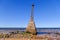 Ruins of the ancient Kurmrags lighthouse on the shore of the Gulf of Riga. Stone masonry in the lower part of the