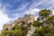 The ruins of the ancient medieval castle Monolithos against a dramatic sky, Rhodes island, Greece