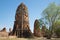 Ruins of ancient prangs of the temple complex Wat Mahathat on a sunny afternoon. Ayutthaya, Thailand