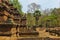 Ruins of an ancient temple in Cambodia. A dilapidated building of red stones