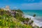 Ruins of ancient Tulum. Architecture of ancient maya. View with sea. Blue sky and lush greenery of nature. travel photo. Wallpaper