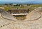 Ruins of the antique amphitheatre in Greco Roman city Hierapolis, Pamukkale, Turkey. Aerial panoramic view