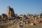 Ruins of Appollo temple with fortress at back in ancient Corinth, Peloponnese, Greece