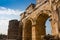 Ruins of Appollo temple with fortress at back in ancient Corinth, Peloponnese, Greece