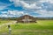 Ruins of the architecturally significant Mesoamerican pyramids and green grassland located at at Teotihuacan, an ancient