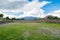 Ruins of the architecturally significant Mesoamerican pyramids and green grassland located at at Teotihuacan, an ancient