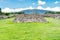 Ruins of the architecturally significant Mesoamerican pyramids and green grassland located at at Teotihuacan, an ancient