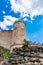 Ruins of Boskovice castle - view of surrounding walls and tower. Summer day, blue sky. Tourism in the Czech Republic - ancient