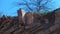 Ruins of brick house in broken rock mountain after earthquake tsunami disaster.