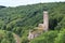 Ruins of the castle Philippsburg on a hill spur above Eifel village of Monreal, Germany