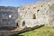 The ruins of the castle. Window on old castle in the rocks Podhradie, Topolcany, Slovakia