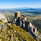 Ruins of Chateau de Queribus on rocky hilltop in summer, France