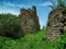 Ruins of dead medieval city in green high mountains like Machu Picchu in Russia