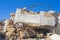 Ruins of desolate home against blue sky.