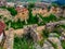 Ruins and destroyed walls of the Rasnov fortress in Romania. Archaeological site of a medieval citadel overgrown with young, lush