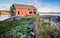 The ruins of a fisherman`s shed on the coast of the Norwegian fjord