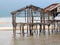 Ruins of flooded wooden house after tornado