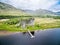 The ruins of historic Kilchurn Castle and jetty on Loch Awe