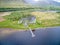 The ruins of historic Kilchurn Castle and jetty on Loch Awe