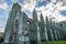 The ruins of Holyrood Abbey still stand tall and proud behind the Queen`s Gallery Palace in Edinburgh Scotland