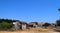 Ruins of homes and huts in a town following natural disaster, calamity, and war - Mass Destruction and Damage