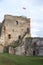 The ruins of the Livonia Order Castle was built in the middle of the 15th century. Bauska Latvia in autumn. Latvian flag on the to