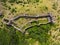 Ruins of medieval fortress Maglic on top of hill by the Ibar river in Serbia. Aerial view.