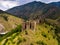 Ruins of medieval fortress Maglic on top of hill by the Ibar river in Serbia. Aerial view.